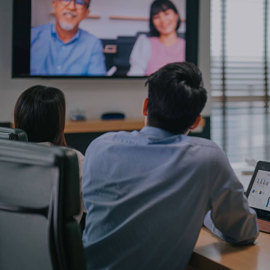 Business People in Conference Room with Smart Technology