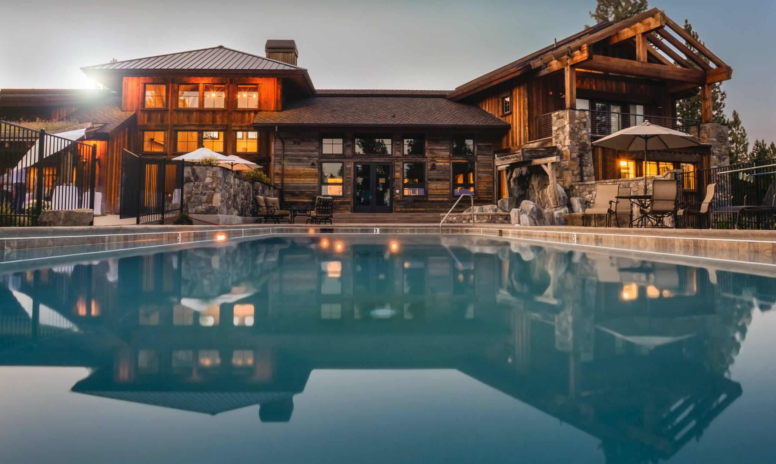 Photo of a large mansion with a pool